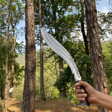 man holding 10 inch 3 chirra khukuri knife used in camping